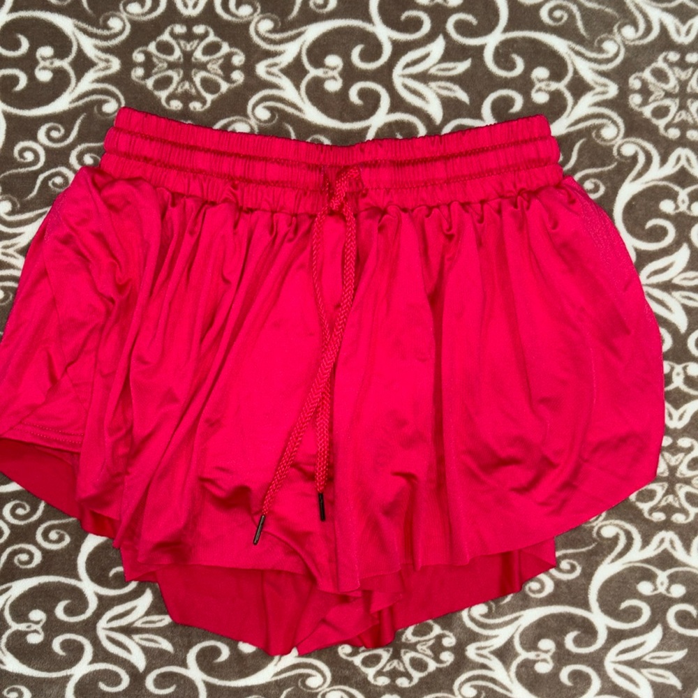 Women’s athletic shorts Pink in color. Size M